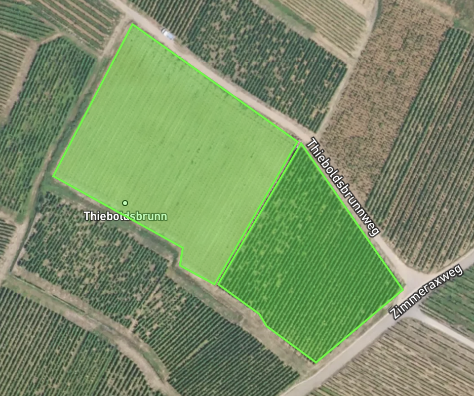 Sattelite image of two plots of land with the boundaries highlighted